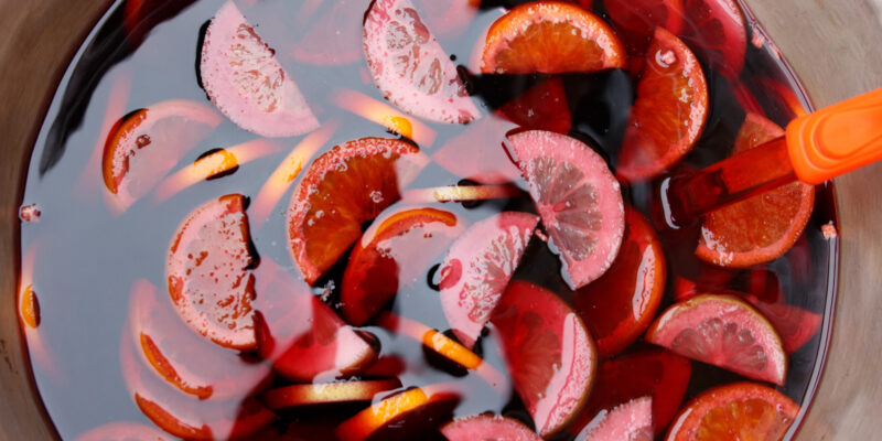 Bowl of traditional sangria or punch made of red wine with lemon slices